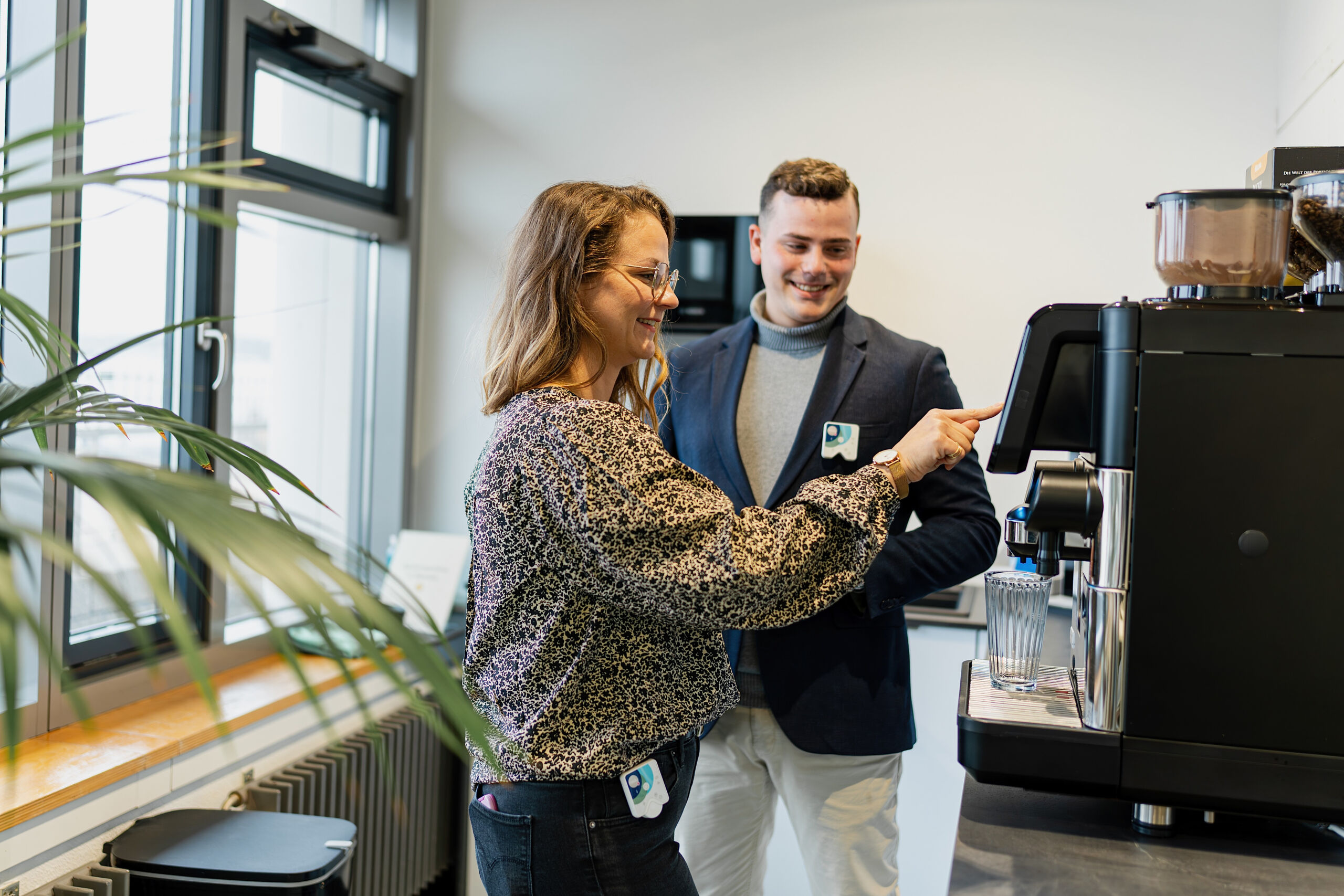 Healy team on a break in front of the coffee machine